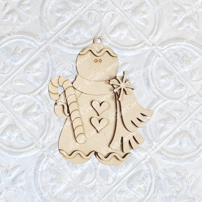 Janet's Craft Corner Gingerbread Ornaments DIY holiday craft kit features 8 wooden figures with heart cutouts, candy cane and Christmas tree accents—perfect for festive décor. Set against a white embossed background.