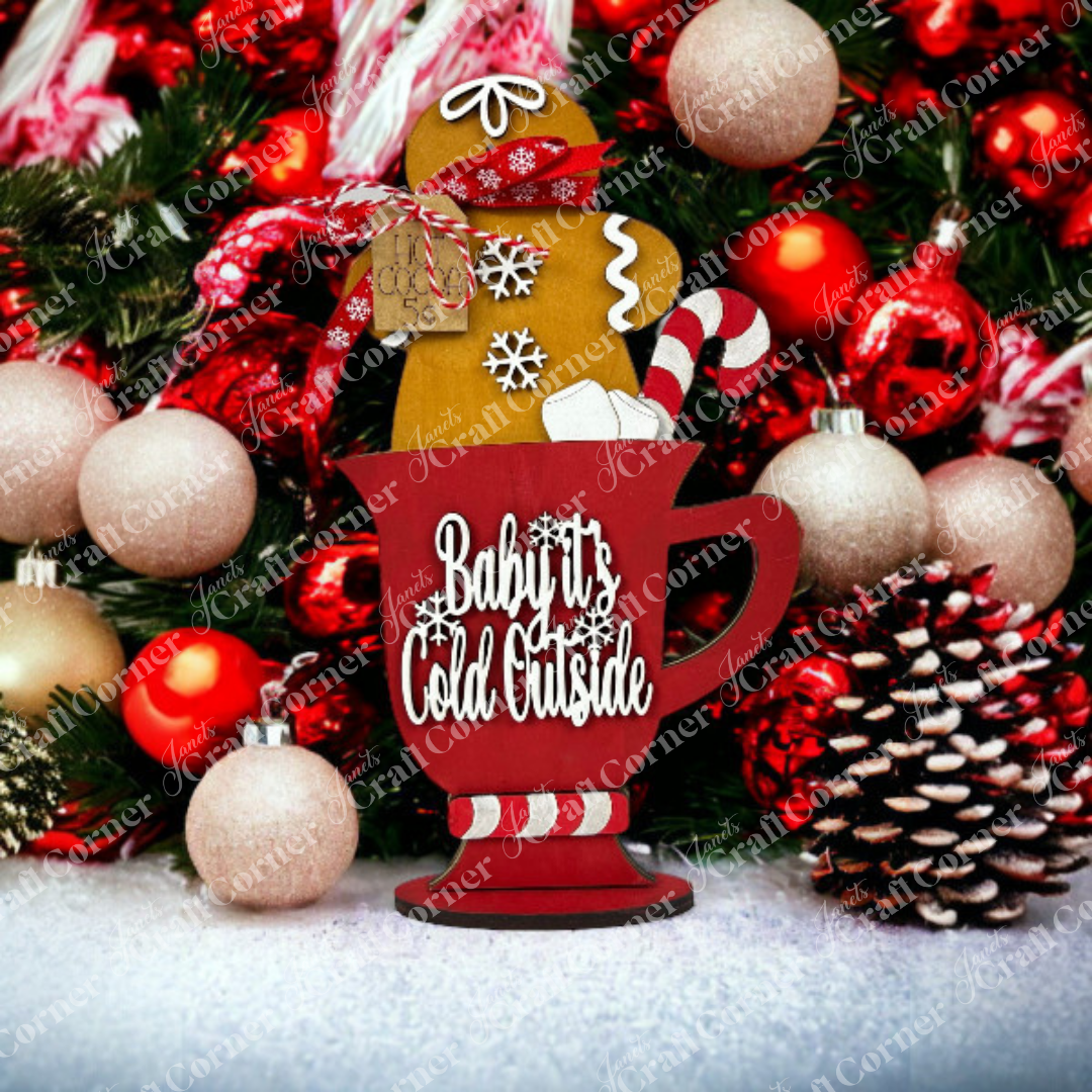 Add festive charm to your home with Janet's Craft Corner Gingerbread Hot Cocoa Mug Shelf Sitter DIY kit—features a red mug, holiday decor, and ornaments; perfect seasonal home decor or cozy shelf accent. Set of 1.