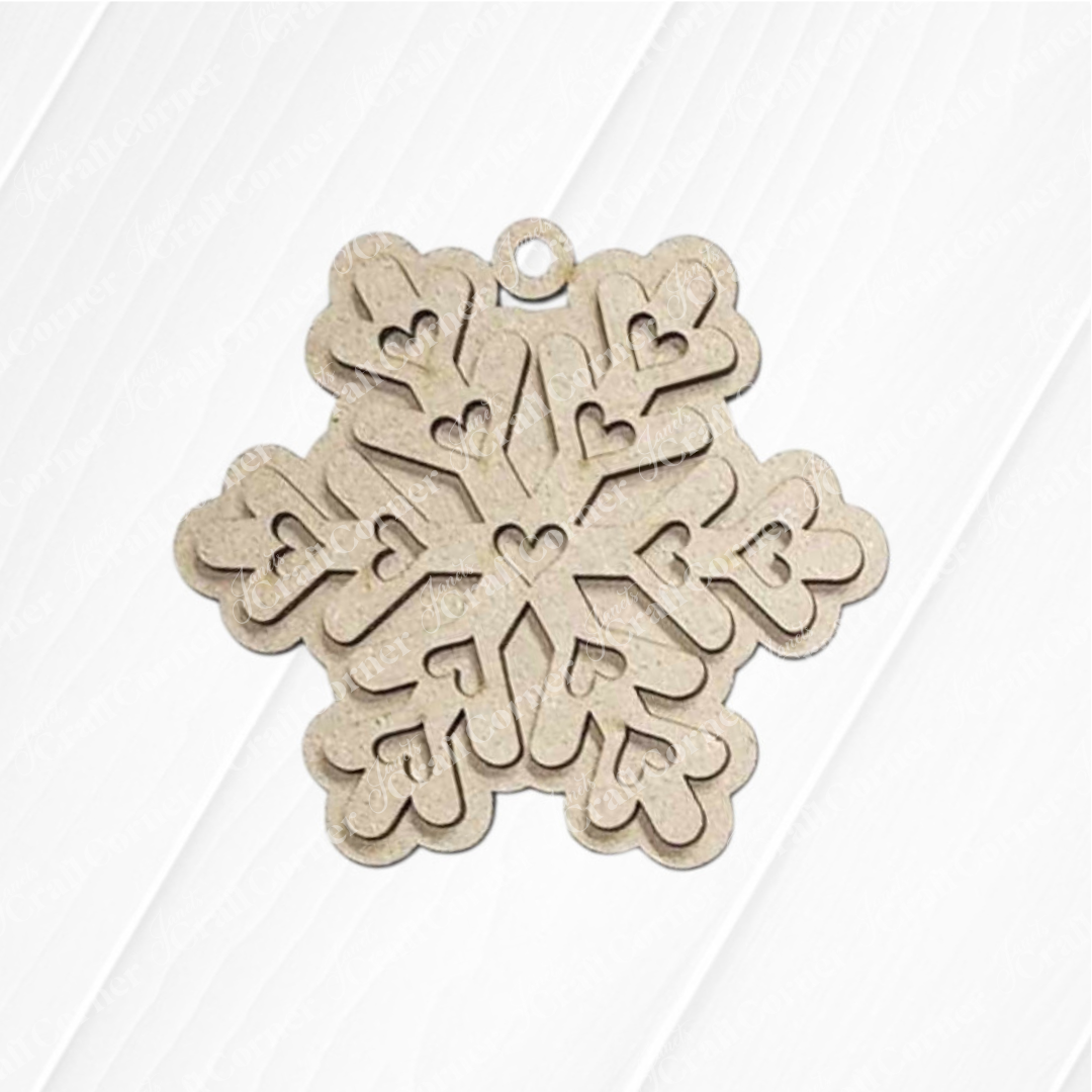 The Gingerbread Iced Cookie Ornaments DIY holiday craft kit by Janet's Craft Corner includes 6 ornaments, each with a hole for hanging. Perfect for homemade Christmas tree decorations or festive DIY projects on a white, textured background.