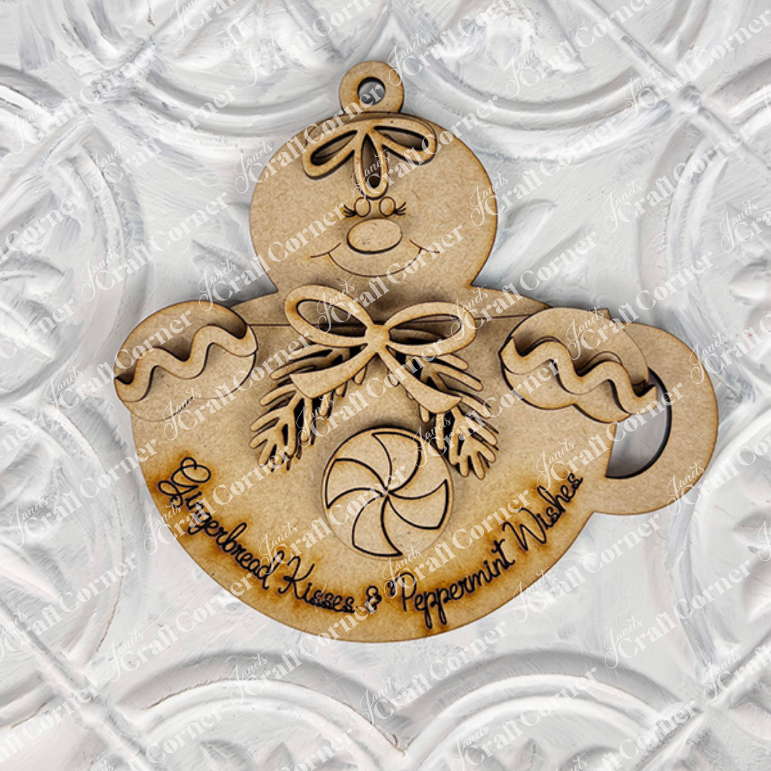 Janet's Craft Corner Gingerbread Ornaments DIY holiday craft kit includes 8 cookie-shaped ornaments with bowties and peppermint details. Features “Gingerbread Kisses & Peppermint Wishes” text. Display on a white textured background.