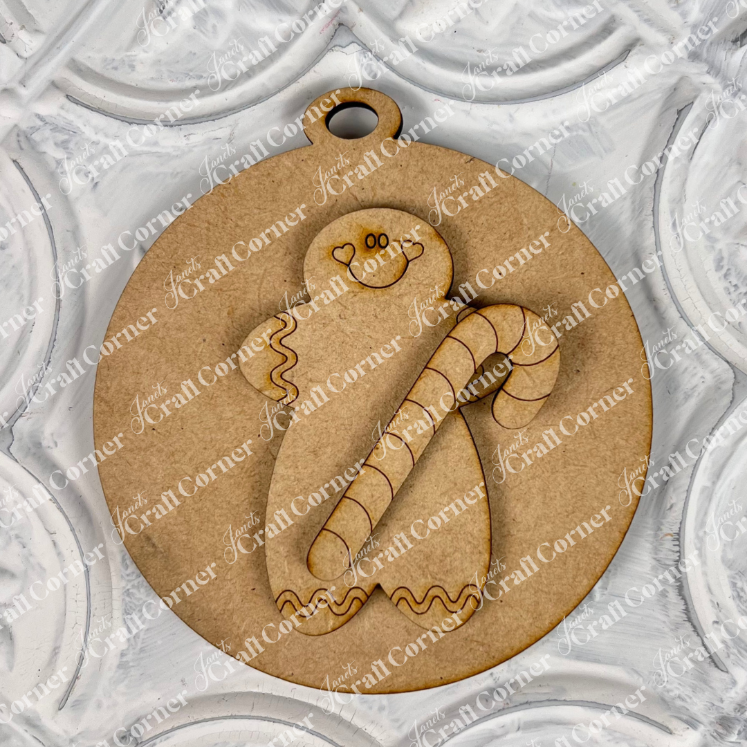 Discover a delightful addition to your festive decorations with Janet's Craft Corner's Round Christmas Ornaments. This charming wooden ornament features a gingerbread person holding a candy cane, beautifully set against a textured white background with circular patterns. Perfect for your holiday decor!