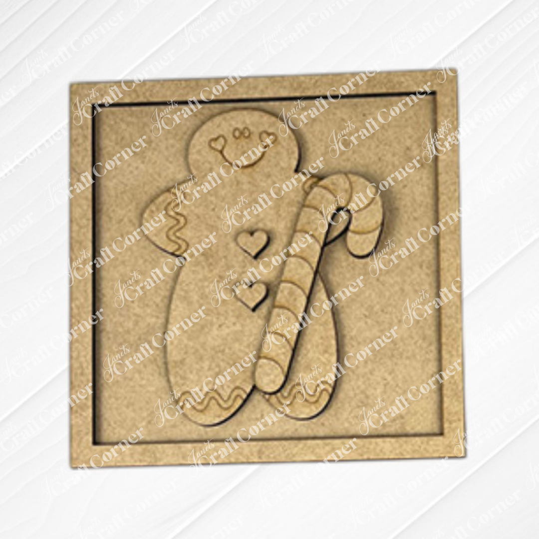 The Gingerbread Squares by Janet's Craft Corner are square wooden plaques engraved with a smiling gingerbread holding a candy cane, ideal for tiered tray signs or DIY holiday decor with cute buttons and frosting details.