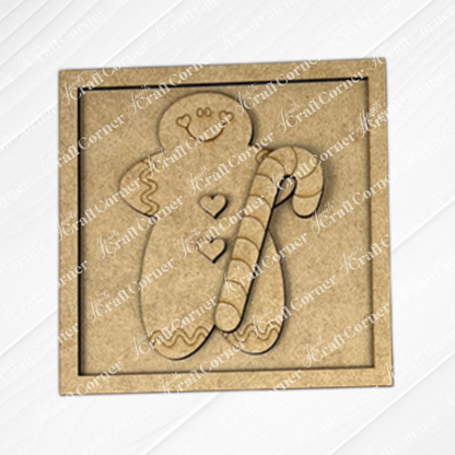 The Gingerbread Squares by Janet's Craft Corner are square wooden plaques engraved with a smiling gingerbread holding a candy cane, ideal for tiered tray signs or DIY holiday decor with cute buttons and frosting details.