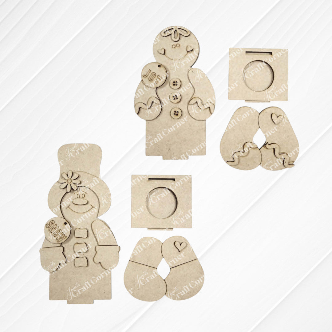 A set of unpainted MDF cutouts from Janet’s Craft Corner, featuring the Snowman & Gingerbread Votive Holder Shelf Sitters DIY home decor craft kit, is displayed on a white wooden surface. The pieces can be assembled into charming figures, complete with separate arms and accessories like signs and hearts, making an ideal set for holiday crafting or festive Christmas displays. Perfect as votive holder shelf sitters to brighten up your seasonal décor!.