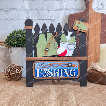Janet's Craft Corner Gone Fishing Interchangeable Insert is a DIY seasonal home decor craft kit featuring 3 fishing-themed pieces, perfect for adding rustic charm to your space.