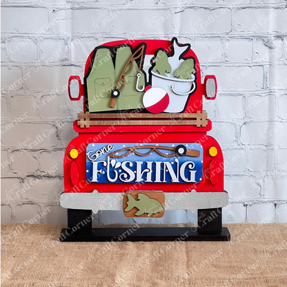 Janet's Craft Corner Gone Fishing Interchangeable Insert is a DIY craft kit (1 set of 3 pieces) featuring a red truck with fishing gear and a “Gone Fishing” tailgate sign—perfect for seasonal home decor.