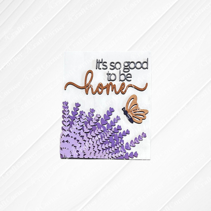 Janet's Craft Corner Lavender Switchable Farmhouse Sign—DIY kit with "It's so good to be home" (home in cursive), butterfly, and lavender on white. Perfect small-space decor or tiered tray accent. Set of 1.