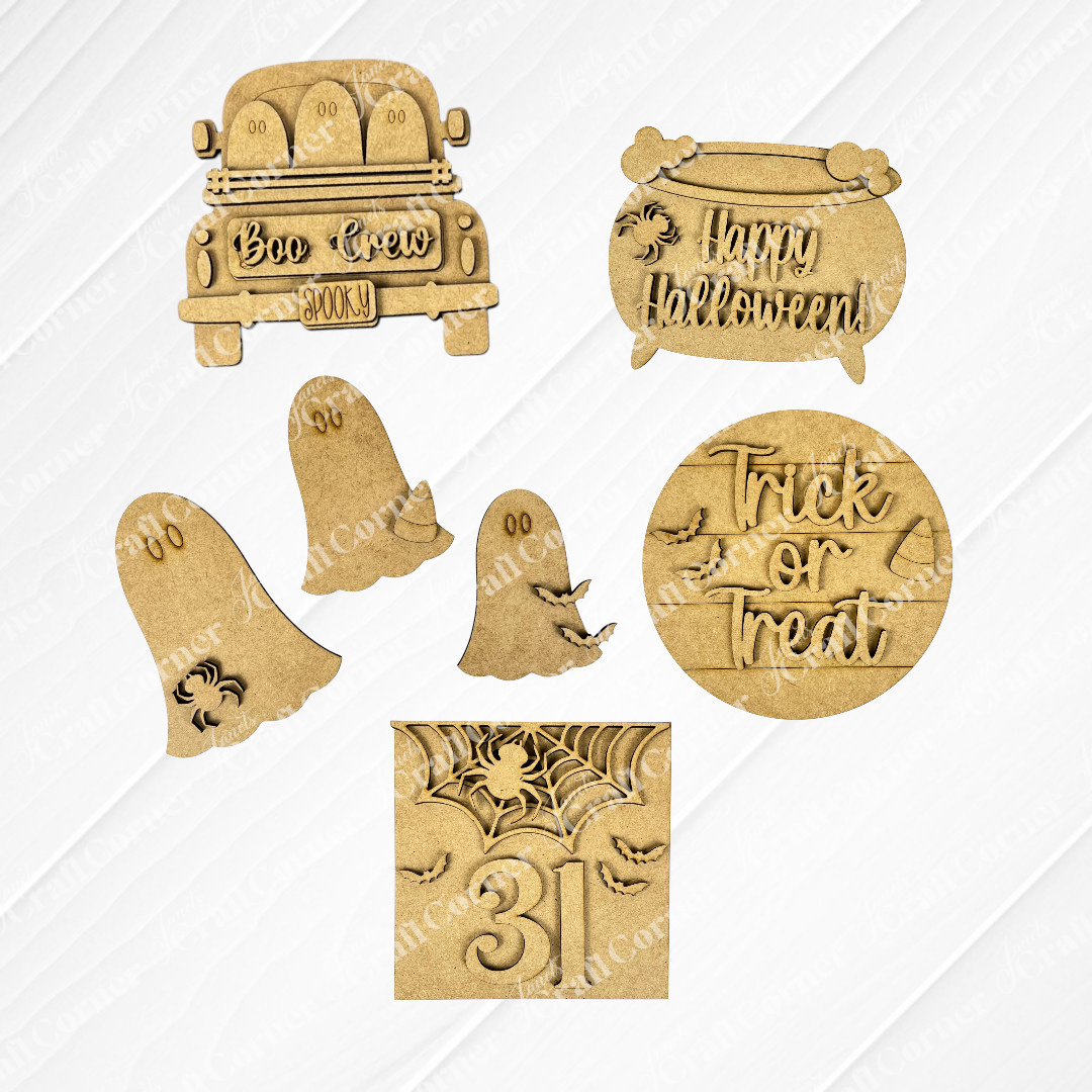 Janet's Craft Corner Halloween Mini Shelf Sitters DIY craft kit includes a car with "Boo Crew," cauldron with "Happy Halloween," 3 ghosts, a "Trick or Treat" sign, and a spiderweb square for fun seasonal home decor. Set of 1.