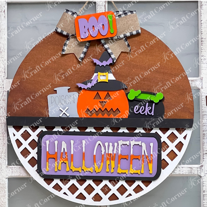Introducing the Halloween Pumpkin Interchangeable Insert from Janet's Craft Corner, a perfect addition to your DIY home decor kit. This round door sign showcases a charming pumpkin wearing a witch hat, a cauldron that exclaims "eek!", and the bold word "BOO!" A delightful bow adorns the top, while "HALLOWEEN" elegantly spans across the lattice bottom, making it ideal for festive interchangeable craft inserts.