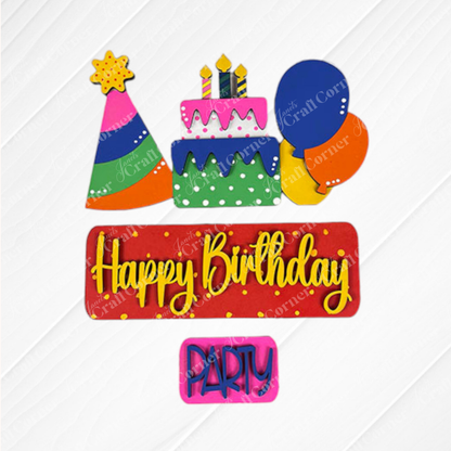 Janet's Craft Corner presents the Birthday Interchangeable Insert DIY home decor kit, which includes vibrant decorations such as a cake with candles, a party hat, balloons, and two signs that read "Happy Birthday" and "Party," all set against a textured white background. Ideal for DIY craft enthusiasts and interchangeable home decor projects.