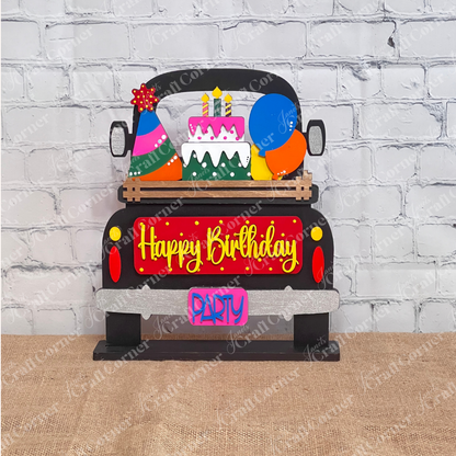 Introducing the Birthday Interchangeable Insert from Janet's Craft Corner—an eye-catching festive decoration shaped like a car. It features a "Happy Birthday" sign, vibrant balloons, and a tiered cake on top, with the tailgate adorned with bright "PARTY" letters on a black antique truck. This part of a versatile DIY home decor kit is ideal for enhancing any craft project.
