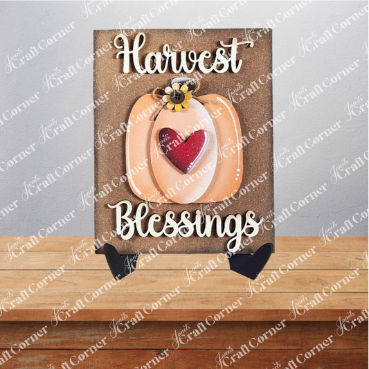Janet's Craft Corner Fall Switchable Farmhouse Signs – a DIY kit featuring a pumpkin with red heart, sunflower, and "Harvest Blessings" in white—perfect seasonal decor for your wooden surface. Set of 1; choose from 9 designs.