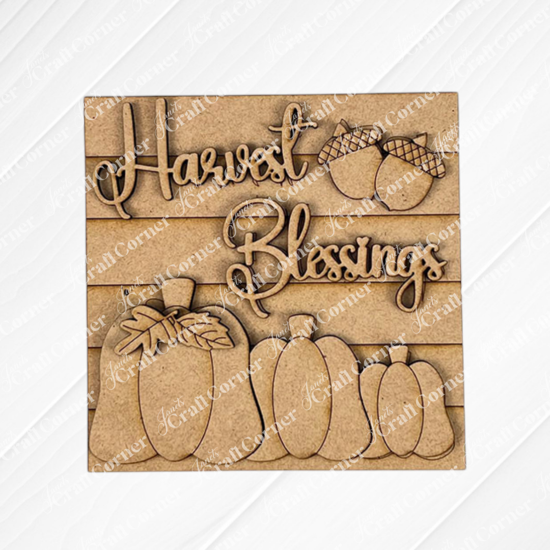 The Harvest Blessings Thanksgiving Squares by Janet's Craft Corner features "Harvest Blessings" in cursive, wood cut-out acorns above, and pumpkins and gourds below—perfect tiered tray decor.