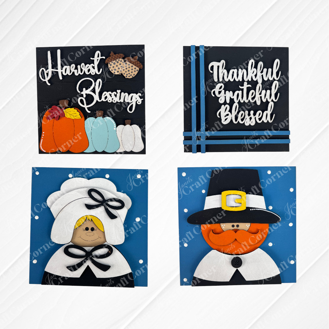 Janet's Craft Corner Harvest Blessings Thanksgiving Squares feature four wood cut-outs: pumpkins with “Harvest Blessings,” “Thankful Grateful Blessed” stripes, a smiling Pilgrim woman, and man—perfect for tiered tray décor.
