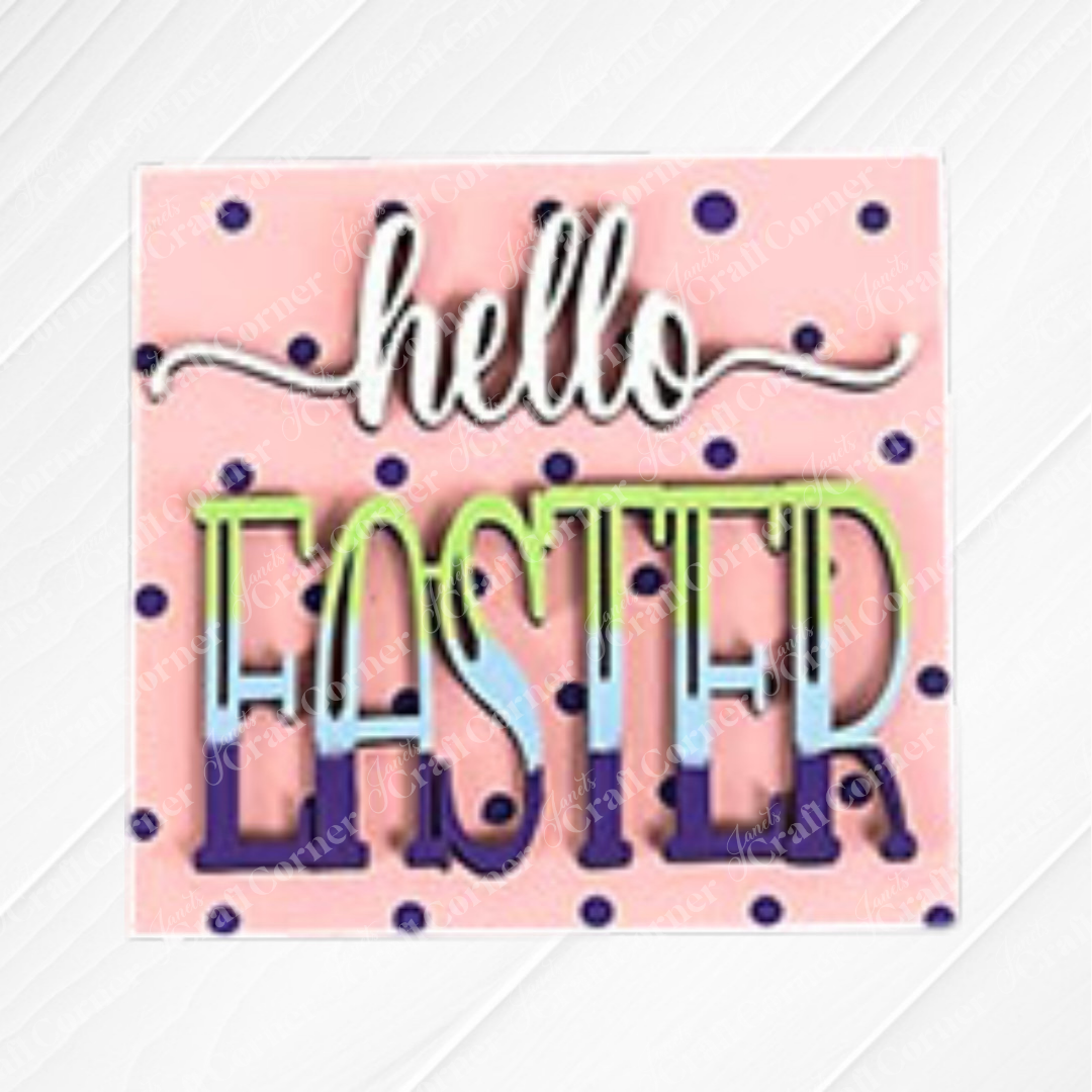 Janet's Craft Corner Hello Easter Squares: Square sign features a pink background with dark blue polka dots, subtle diagonal stripes, and "hello EASTER" in white and pastel rainbow letters—ideal for festive coffee decor or DIY craft displays.