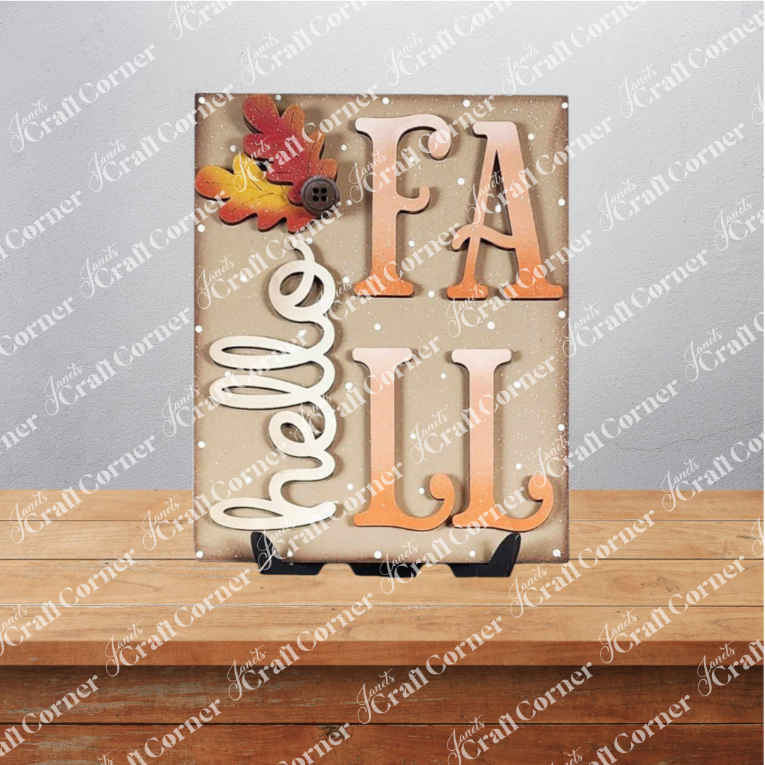 Janet's Craft Corner Fall Switchable Farmhouse Sign, a DIY seasonal home decor craft kit (set of 1, choice of 9), features "hello FALL" with autumn leaves and buttons—adding rustic farmhouse charm to your space.