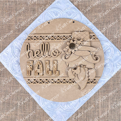 The Hello Fall Gnome Door Hanger from Janet’s Craft Corner features a gnome in a floral hat with a bird on a burlap background. This DIY kit includes everything needed to create this charming fall door hanger, perfect for seasonal home décor.