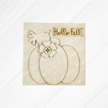The Hello Fall Squares by Janet's Craft Corner is a beige decorative sign featuring a pumpkin with flower and button accents, a “Hello Fall!” script banner, and is perfect for tiered tray decor.