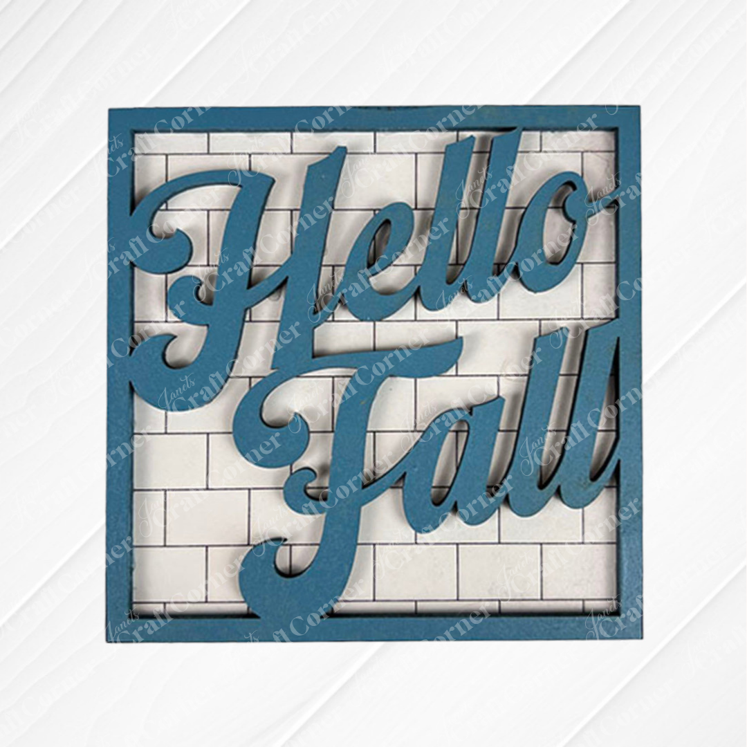 The Hello Fall Squares from Janet's Craft Corner feature a square blue frame with "Hello Fall" in bold cursive on a white brick background, perfect as Swappable Squares or for decorating tiered trays.