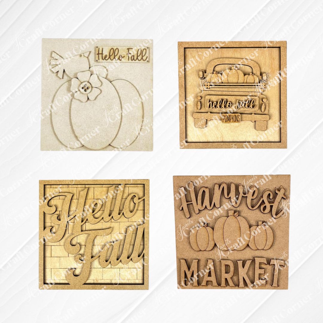 Janet's Craft Corner Hello Fall Squares: set of 4 rustic square wooden signs with autumn designs—pumpkin with "Hello Fall," truck with pumpkins, "Hello Fall" script, and "Harvest Market." Perfect tiered tray décor.