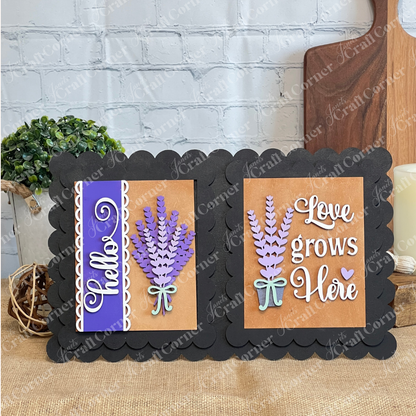 Display charming messages with Janet's Craft Corner Lavender Switchable Farmhouse Signs – DIY Craft Kit, featuring a scalloped frame and two sign inserts: one with a purple "Hello" and bouquet, another with "Love grows Here," perfect for rustic décor.