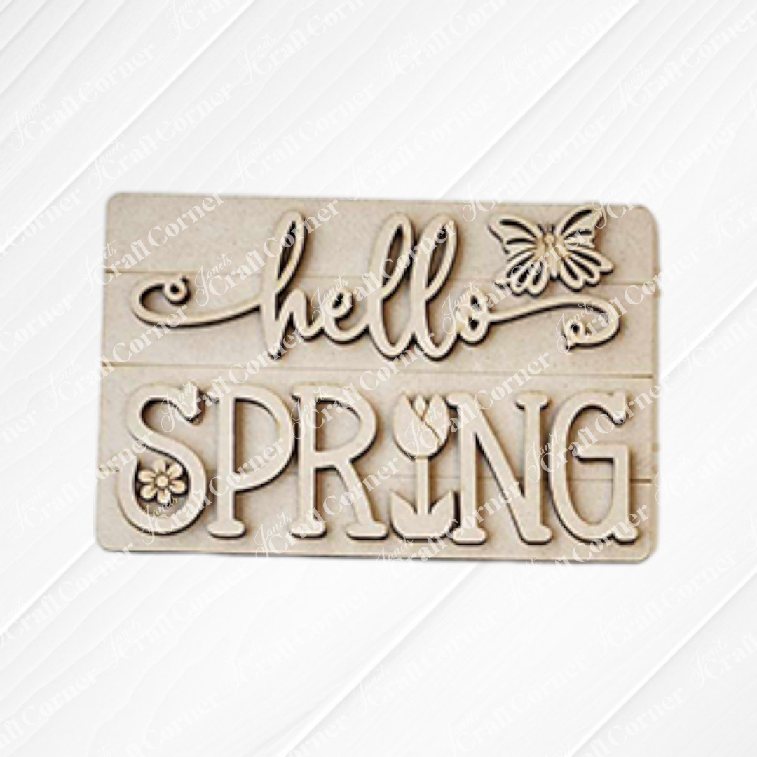 Janet's Craft Corner Hello Spring Decor Set is a DIY Craft Kit with 5 wooden pieces, featuring "hello SPRING" with a butterfly, flower, and tulip. Perfect for farmhouse décor or creative spring crafting.