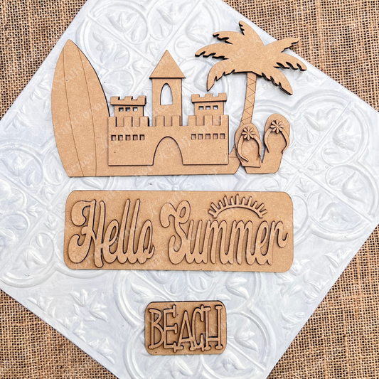The Summer Beach Interchangeable Insert, a DIY home decor kit by Janet's Craft Corner, features wooden beach-themed cutouts on a textured surface. This versatile decor set includes a surfboard, sandcastle, palm tree, flip-flops, and signs engraved with "Hello Summer" and "Beach." The burlap background with a white tile pattern adds charm and adaptability to any space.