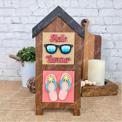 Add a splash of summer with Janet's Craft Corner Summer Lovin Swappable Squares DIY kit—features wooden house-shaped sign, "Hello Summer" in colorful letters, sunglasses, and floral flip-flops for playful, customizable tray decor.
