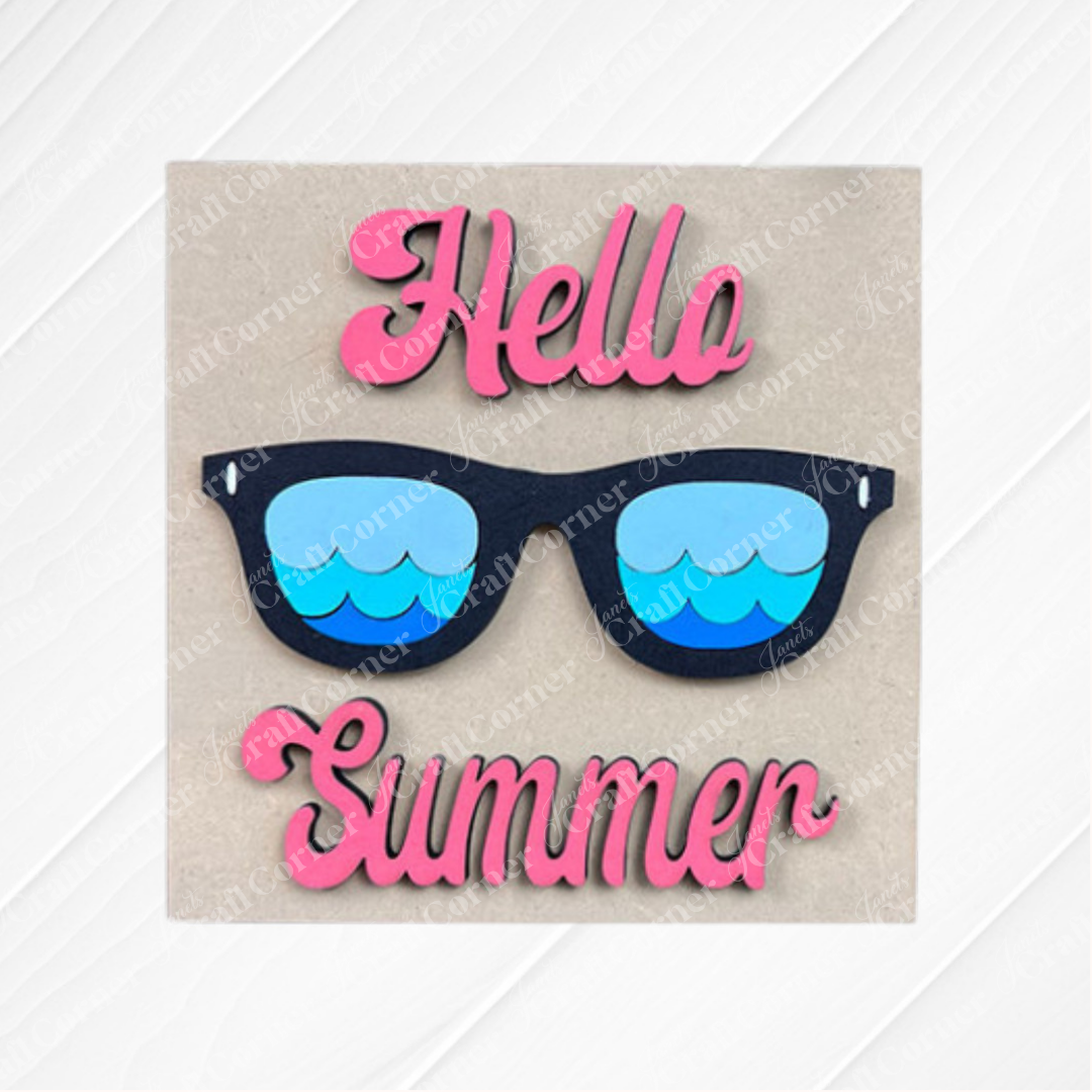 The Summer Lovin Swappable Squares DIY craft kit from Janet's Craft Corner features a "Hello Summer" card with pink text and black sunglasses on a light background—ideal for tiered tray decor or your Swappable Squares display.