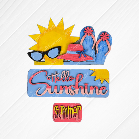 The Hello Sunshine Interchangeable Insert by Janet's Craft Corner is a decorative DIY home decor kit that showcases summer-themed artwork, including a sun, sunglasses, flip-flops, and a hat. It features the text "Hello Sunshine" and "Summer" set against a textured background, making it an ideal choice for crafting enthusiasts to create hand-painted projects for their homes.
