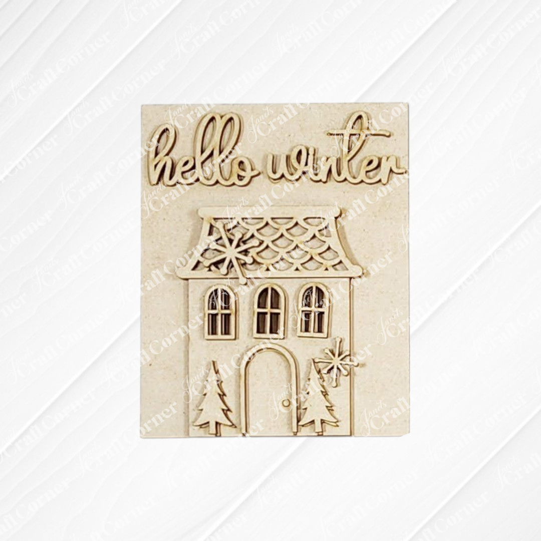 Janet's Craft Corner Welcome Winter Switchable Farmhouse Signs—DIY seasonal home decor kit featuring a house, pine trees, snowflakes, and “hello winter” in cursive—perfect for cozy winter decorating. Choice of 3 designs.
