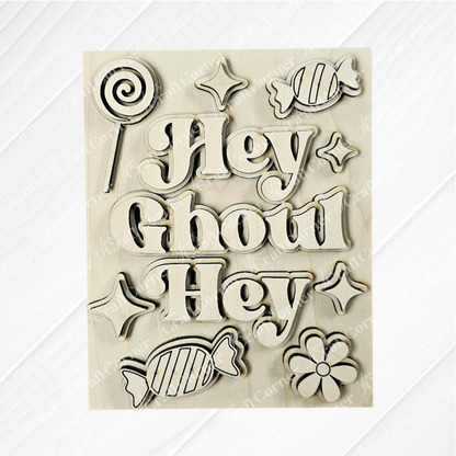 Janet's Craft Corner Halloween Farmhouse Signs kit features wooden cutouts—"Hey Ghoul Hey," candies, flower, lollipop, and sparkling stars—perfect for DIY tiered tray decor and festive home accents.