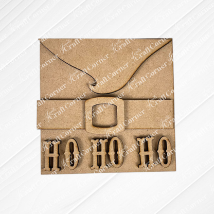 Santa Squares from Janet's Craft Corner is a brown cardboard square card styled like Santa's suit, with a black belt, gold buckle, and “HO HO HO” cut-out letters—ideal for festive DIY home decor. Part of the Swappable Squares craft kit.