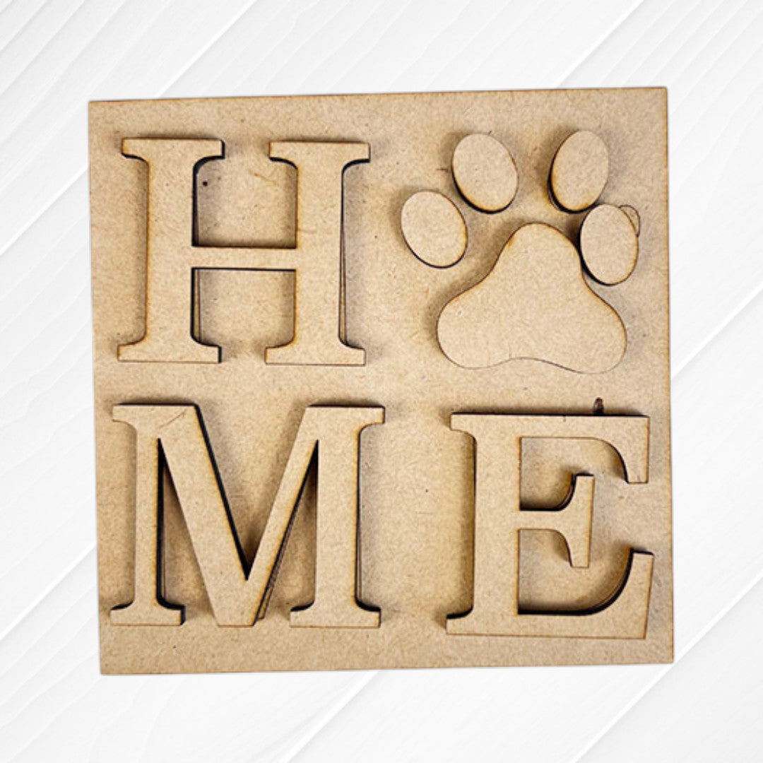 Dog Squares by Janet's Craft Corner: wooden "H", "M", and "E" letters plus a paw print cut-out for the "O" to spell "HOME." Light wood background, ideal for tiered tray decor or customizing with Swappable Squares.