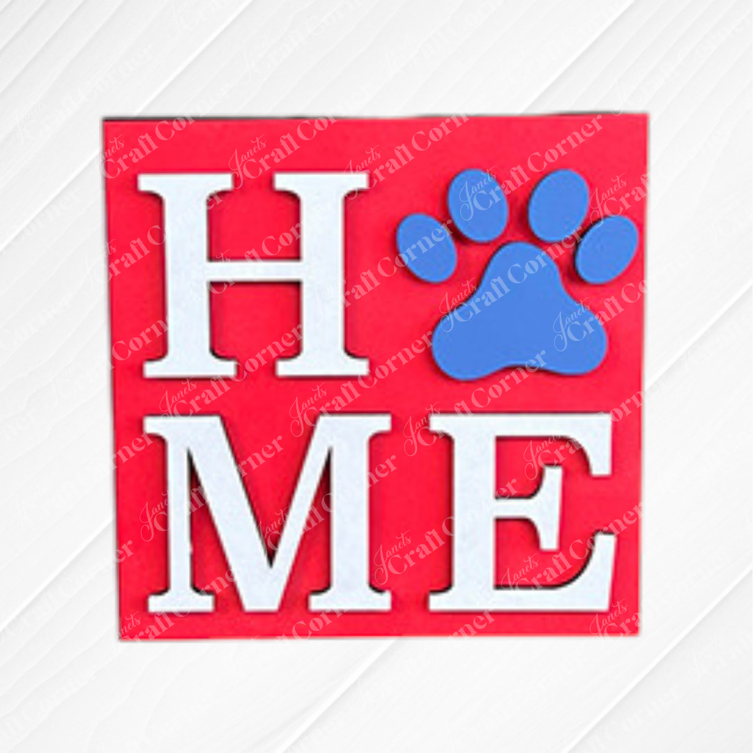 Dog Squares by Janet's Craft Corner: a red wood square with "HOME" in white, the "O" as a bold blue paw print. Perfect Swappable Square for tiered tray decor.