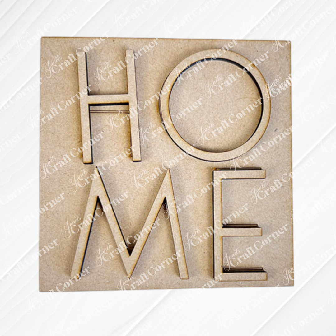 Home Squares by Janet's Craft Corner features wood cut-out letters spelling "HOME" in a square layout—ideal for tiered tray decor or your Swappable Squares collection. Displayed on a light textured background.