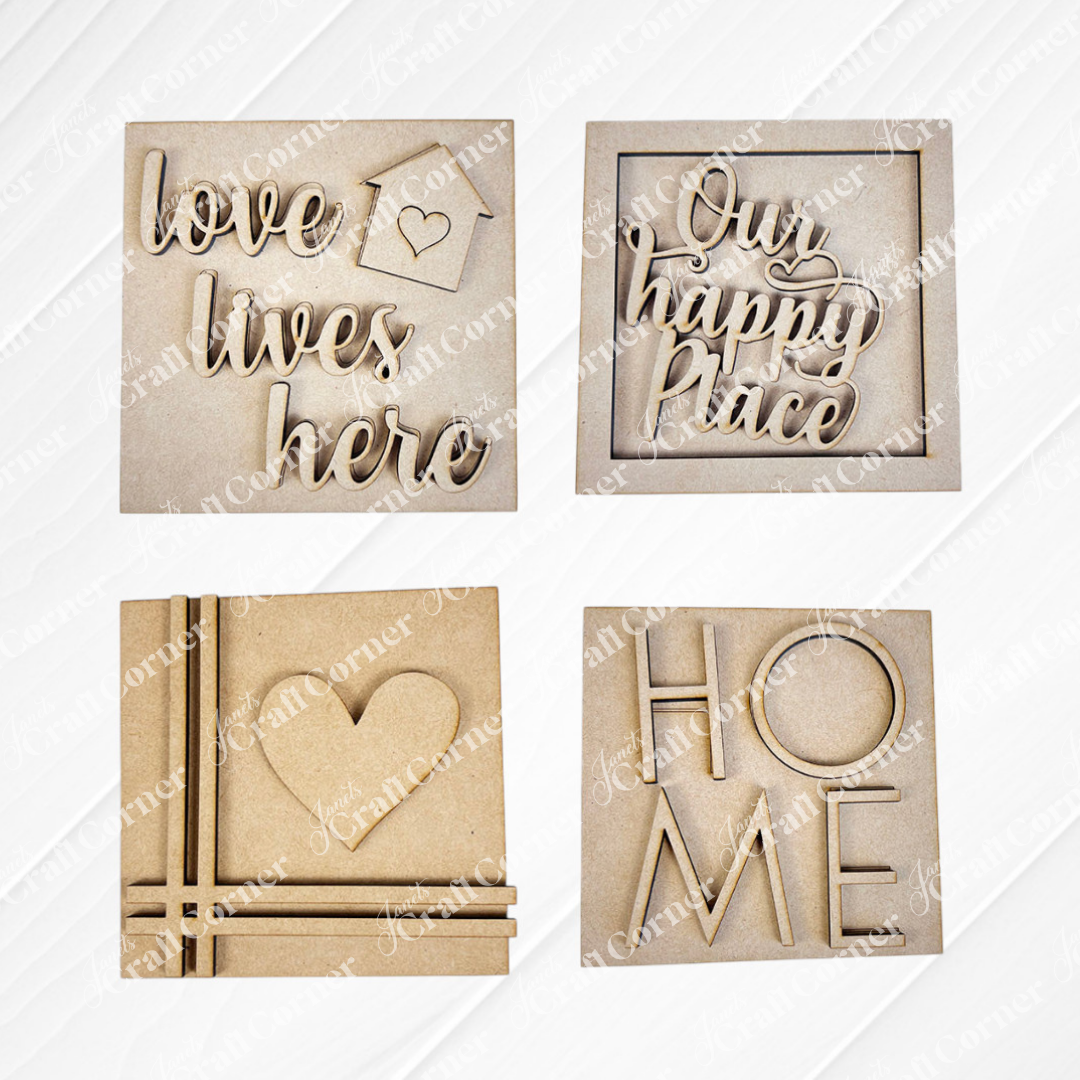 Janet's Craft Corner Home Squares: set of four wood cut-outs with "love lives here" & heart, "Our happy place," heart design, and "HOME" with a heart for the O—perfect tiered tray decor or Swappable Squares.