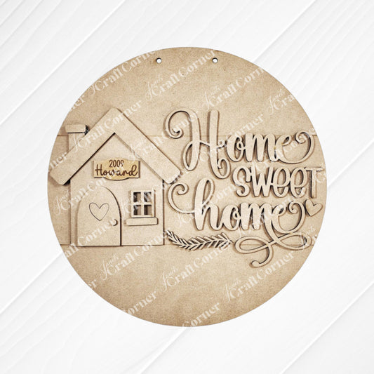 The "Home Sweet Home Door Round" by Janet's Craft Corner is a round wooden plaque for home décor. It features the text "Home Sweet Home," a house design with a heart, and "Welcome" on a white panel, making it ideal as a DIY craft kit to personalize any living space.