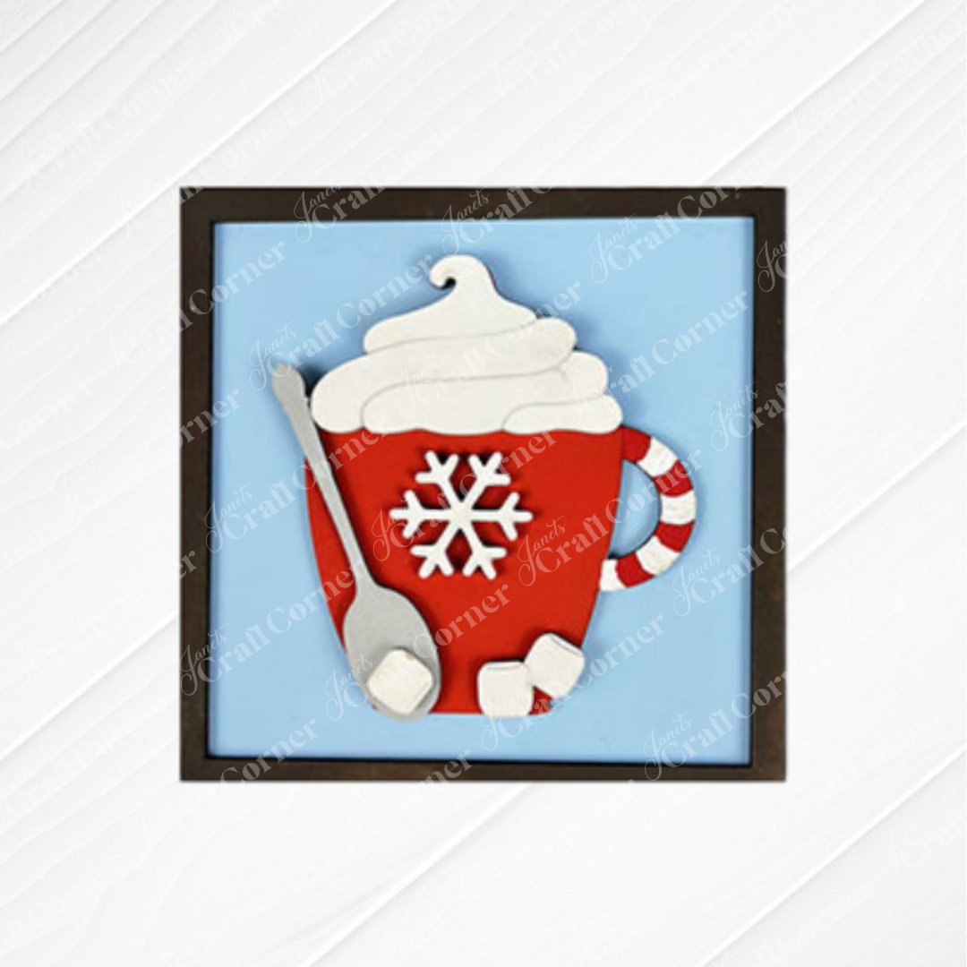 Add festive charm to your space with "Hot Cocoa Squares" by Janet's Craft Corner—a framed artwork featuring a red mug with whipped cream, candy cane handle, and marshmallows on a light blue and textured white background. Perfect for DIY seasonal decor!.