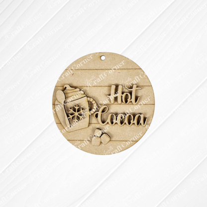 The Hot Cocoa Round Ornament by Janet's Craft Corner is a charming DIY décor piece. With its wooden mug design adorned with a candy cane, snowflake pattern, "Hot Cocoa" text, and three marshmallow shapes on a textured white background, it adds whimsical flair to your holiday setup.