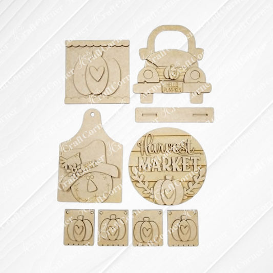 Janet's Craft Corner unfinished wood fall harvest decor craft kit featuring pumpkin, truck, and scarecrow designs.
