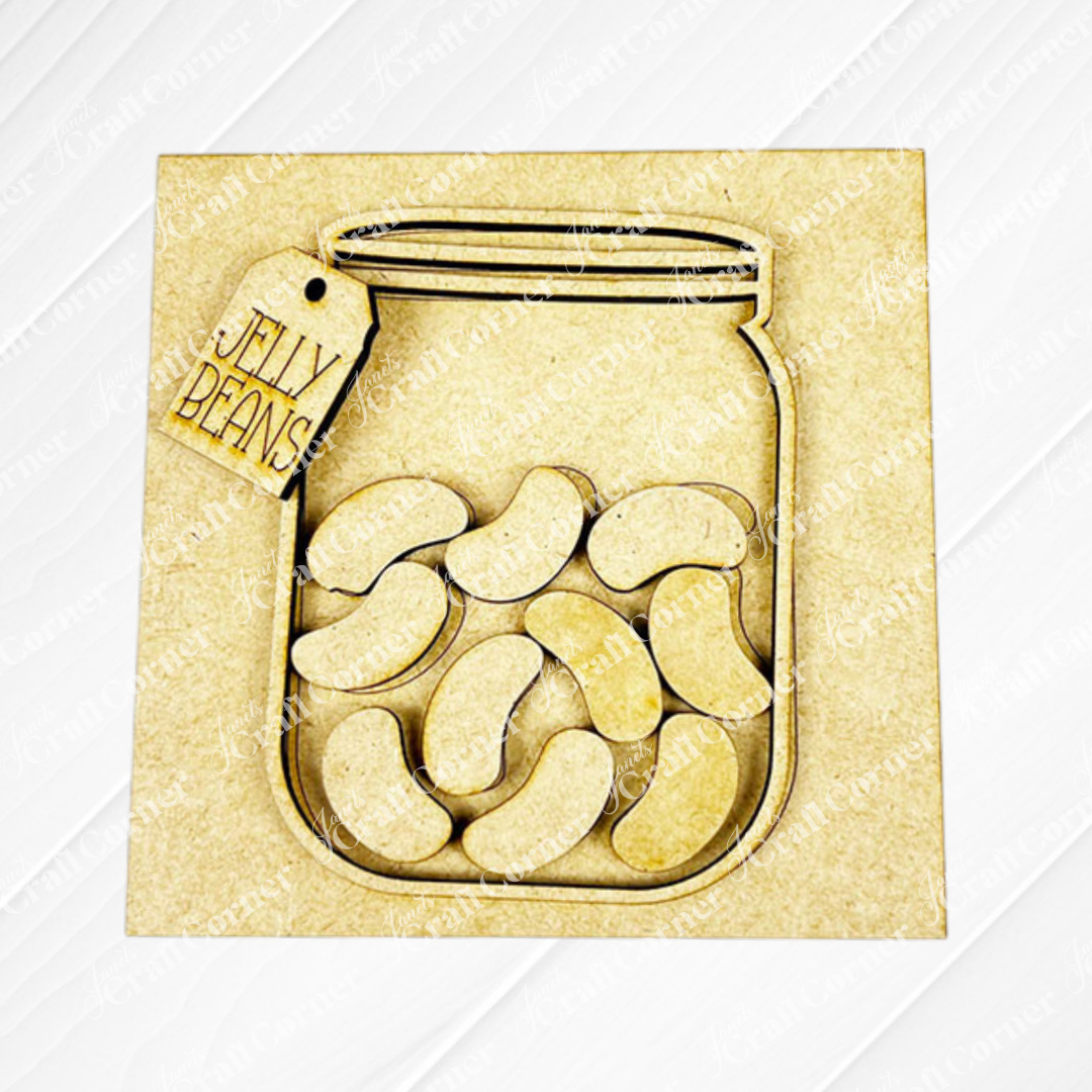 The Hello Easter Squares by Janet's Craft Corner features a wooden jar cutout labeled "Jelly Beans" atop a light square base—ideal as a DIY craft kit for creative Easter-themed personalization.