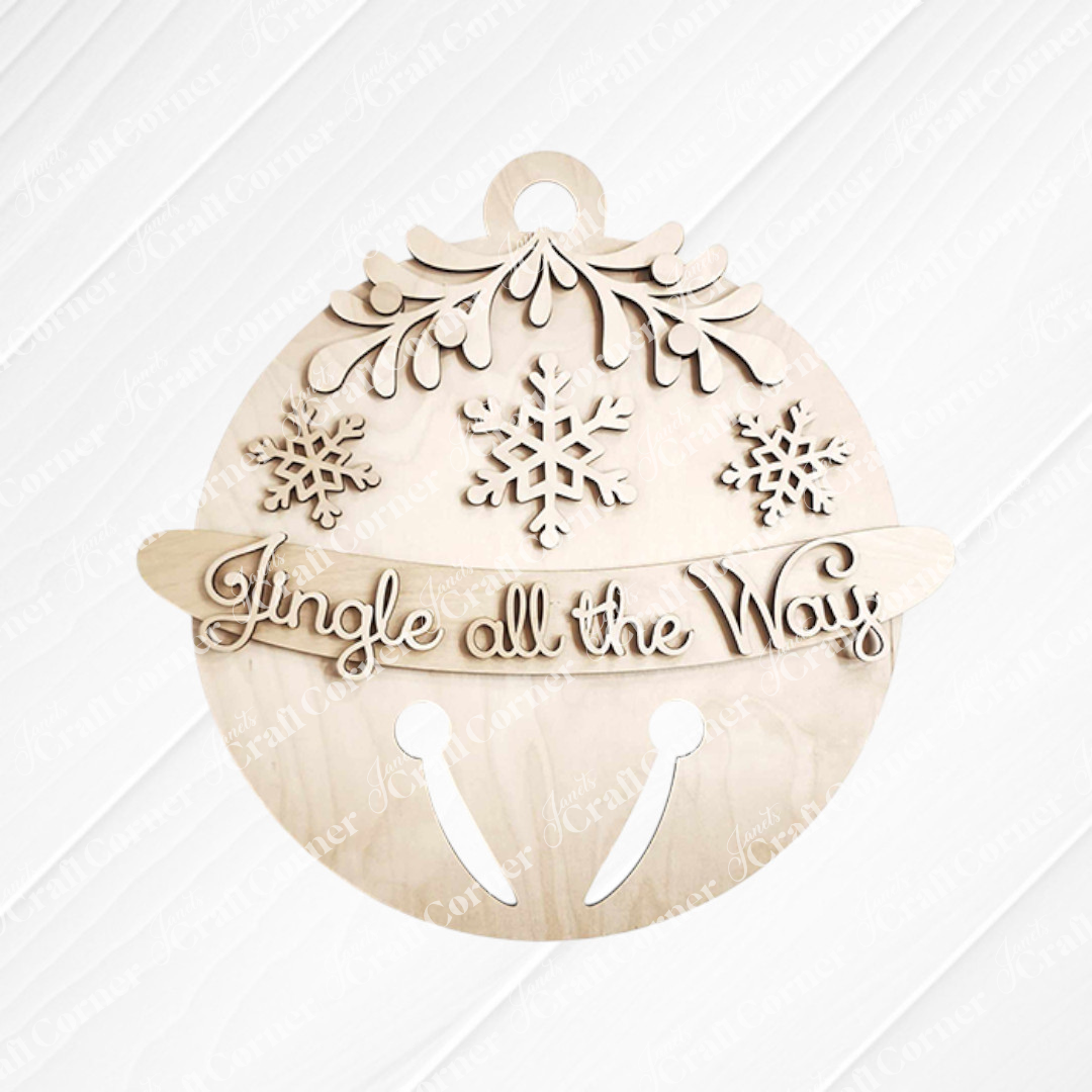 Introducing the Jingle Bell Door Hanger from Janet's Craft Corner: a wooden DIY craft kit designed as a holiday ornament adorned with snowflakes and greenery. It showcases the phrase "Jingle all the Way" in cursive, complete with a cut-out jingle bell pattern at the bottom, making it an ideal addition to enhance your home décor.