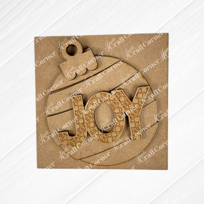 The Christmas Icon Swappable Squares DIY craft kit by Janet's Craft Corner features a square wooden ornament shaped like a bauble with "JOY" cut out in the center, ideal for seasonal home decor or your swappable square signs collection.
