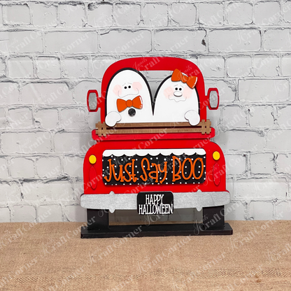 Janet's Craft Corner's Just Say Boo Interchangeable Insert craft kit includes two ghost with orange bows and signs that say "Just Say Boo" and "Happy Halloween"—perfect DIY Halloween decor or insert for your home, featuring three cute pieces displayed on a red antique truck base.
