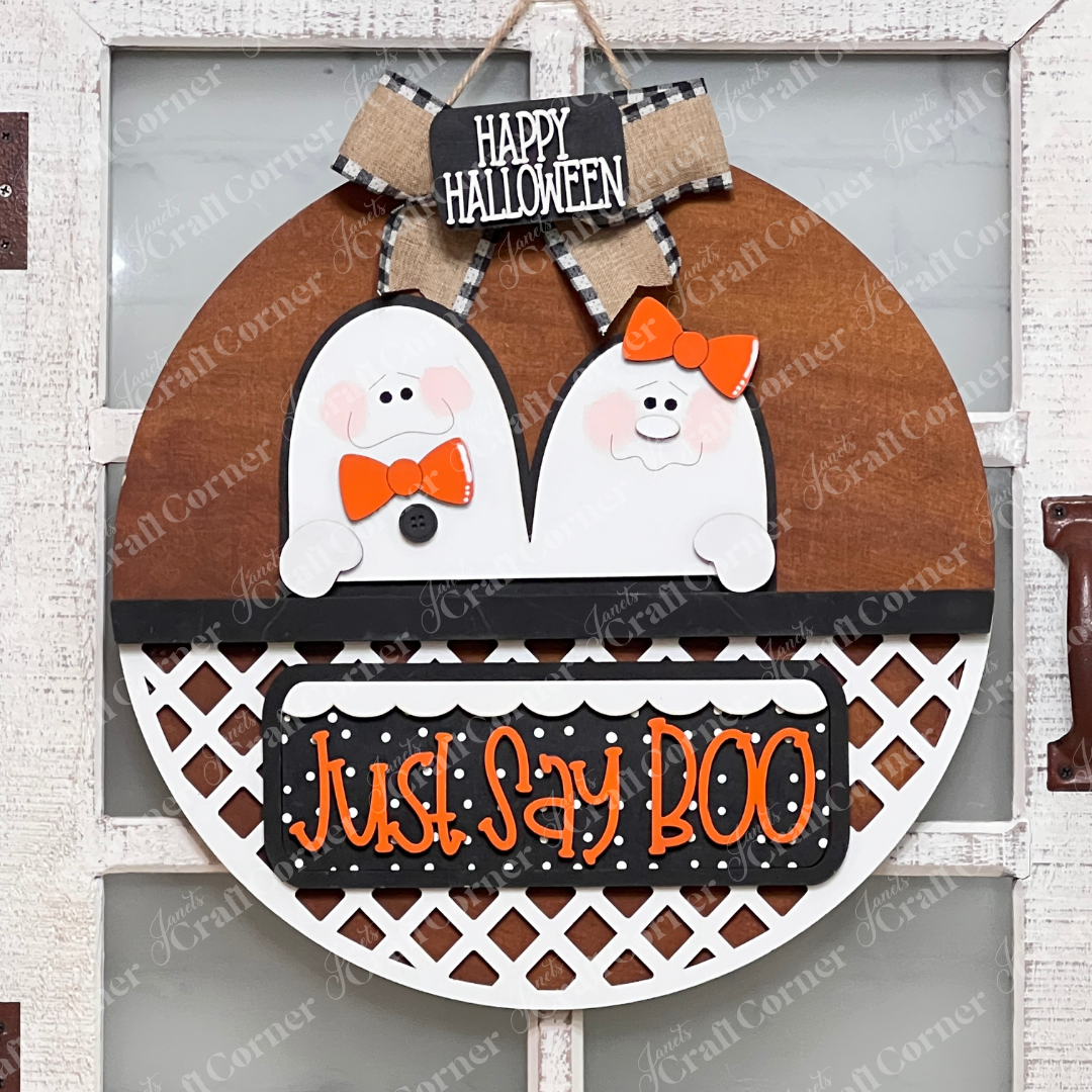 Janet's Craft Corner's Just Say Boo Interchangeable Insert craft kit includes two ghost with orange bows and signs that say "Just Say Boo" and "Happy Halloween"—perfect DIY Halloween decor or insert for your home, featuring three cute pieces displayed on a stained door hanger base.