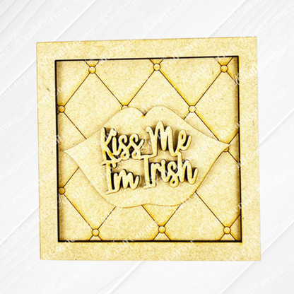 Add charm to your space with Janet's Craft Corner St Patricks Squares—a wooden sign featuring a quilted background, lips cut-out, and "Kiss Me I'm Irish" in cursive. Perfect tiered tray decor; use with Swappable Squares or other cut-outs.