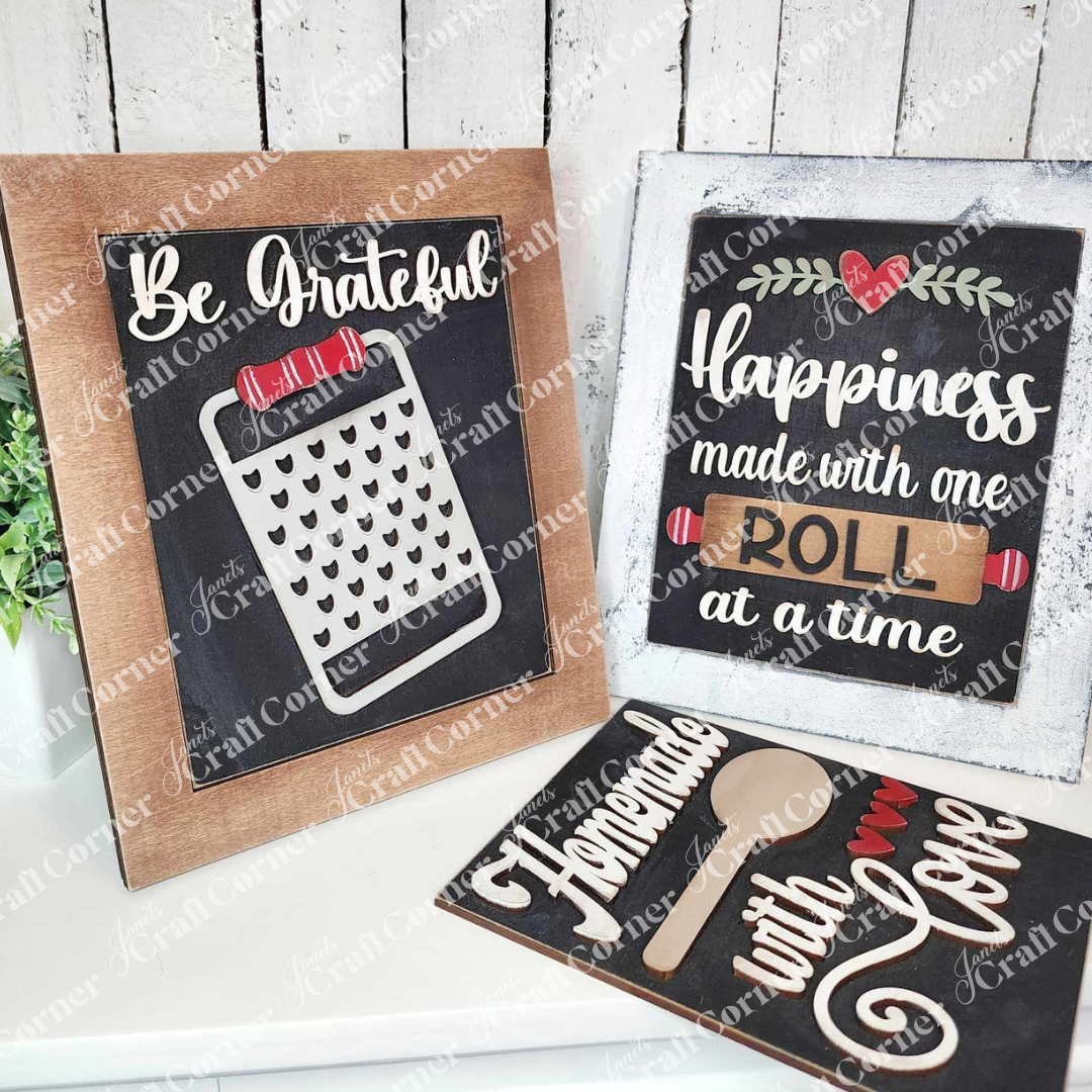 Add cozy farmhouse vibes to your kitchen with Janet's Craft Corner Kitchen Interchangeable Farmhouse Signs DIY decor kit—features “Be Grateful” with a cheese grater, “Happiness made one roll at a time,” and “Homemade with Love.” Set of 1.