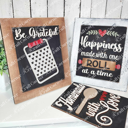 Add cozy farmhouse vibes to your kitchen with Janet's Craft Corner Kitchen Interchangeable Farmhouse Signs DIY decor kit—features “Be Grateful” with a cheese grater, “Happiness made one roll at a time,” and “Homemade with Love.” Set of 1.
