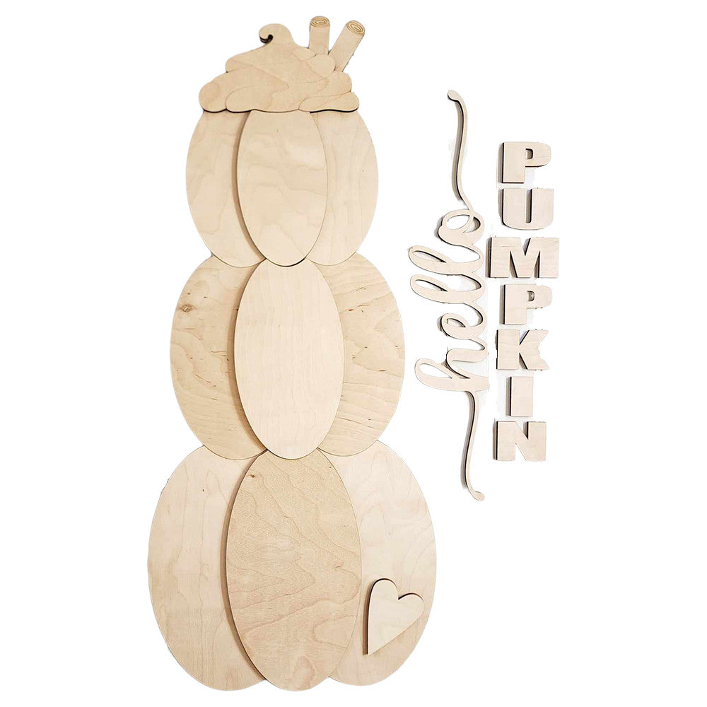 The DIY home decor kit from Janet's Craft Corner, known as the Hello Pumpkin Porch Leaner, comprises unpainted wooden pieces including three stacked pumpkins topped with a leaf, a heart cutout, and letters spelling out "PUMPKIN." It offers simple assembly for creating striking seasonal displays against any white background.